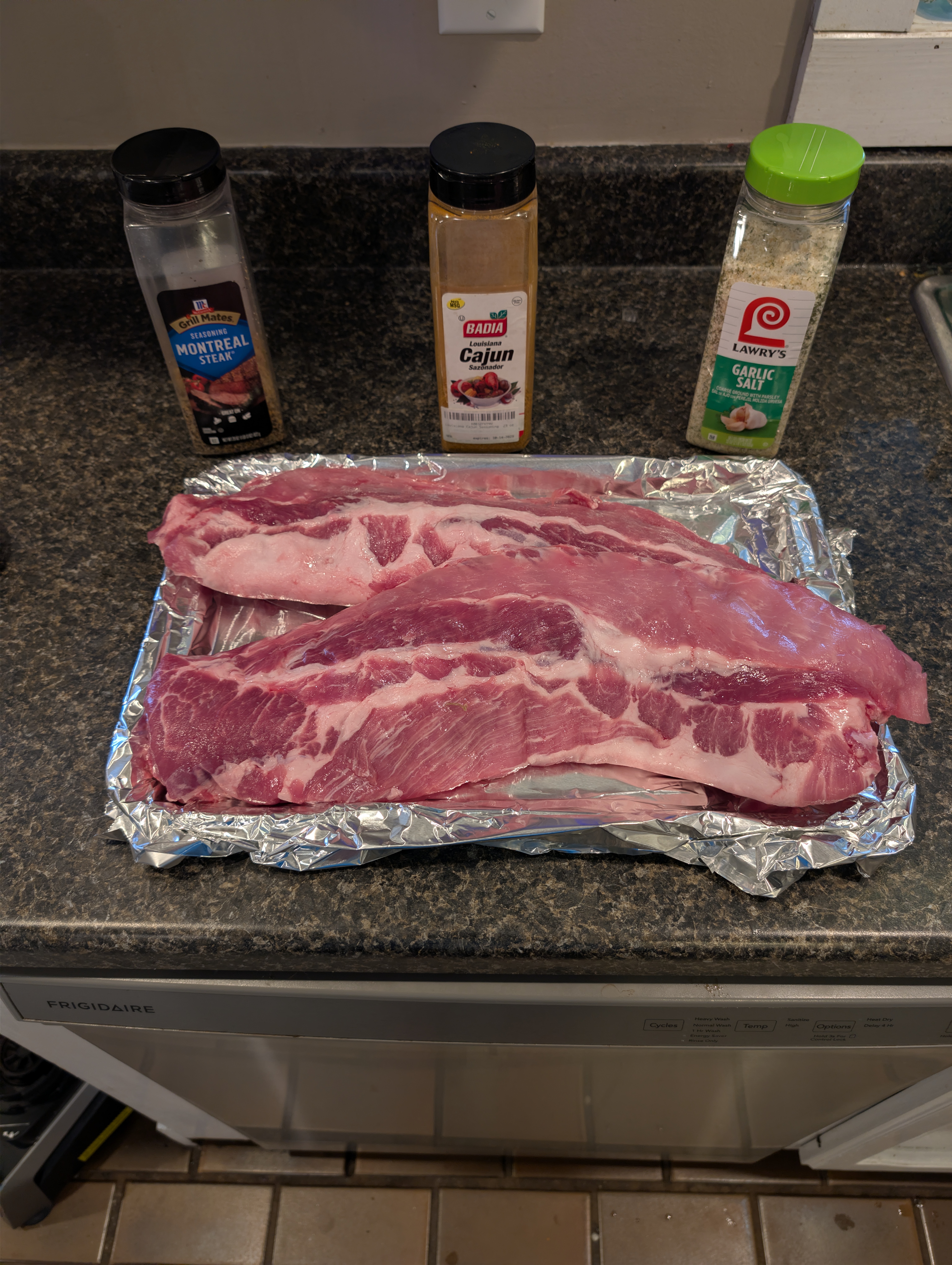 Raw ribs with membrane removed and seasonings ready