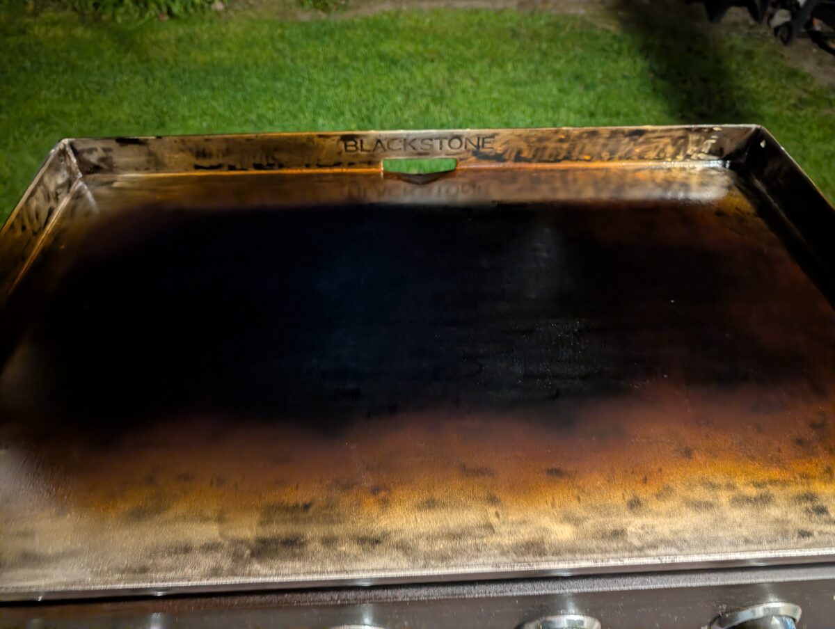 Blackstone griddle surface after restoration showing dark, even seasoning